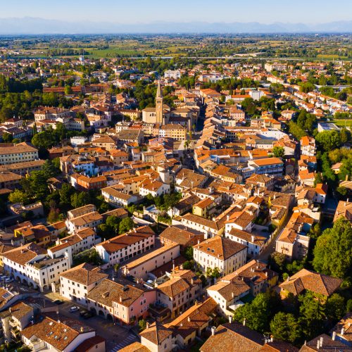 Picturesque aerial view of Portogruaro cityscape in sunny summer day, Italy